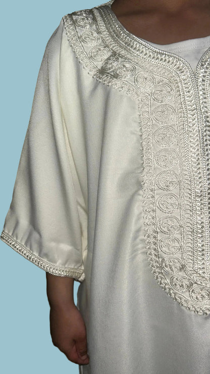 Close-up of chest panel and arm detailing on boys' classic white Moroccan thobe