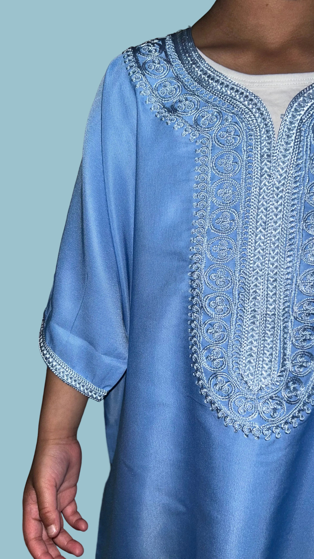 Boys' sky blue Moroccan thobe with baby blue embroidery, close up view